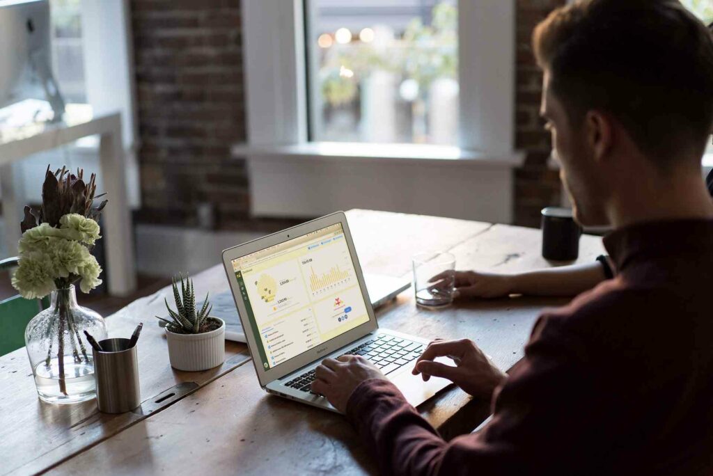 A person learning something on his laptop, trying to develop a skill.